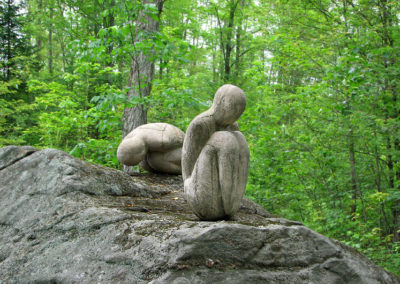 Sculptures on a rock in the forest