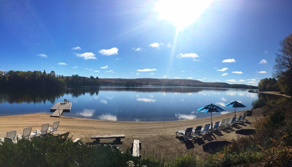 Blue Spruce Resort beach on a sunny day