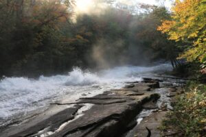 view of the fast moving water flowing down Buttermilk Falls