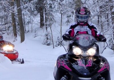 two snowmobile in Haliburton Forest